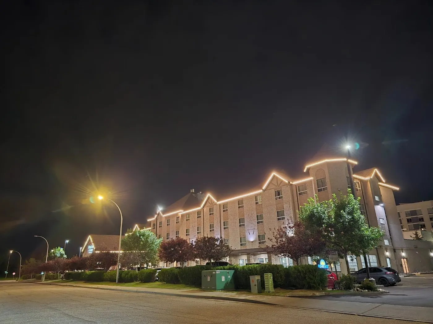 Commercial LED roofline lighting on a hotel exterior at night in Edmonton