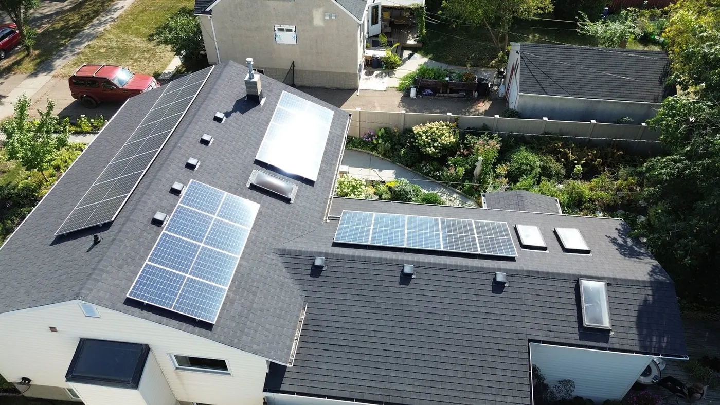 Aerial of Dmitry's Edmonton home with a 9.56 kW solar system across all four roof faces, all-black panels