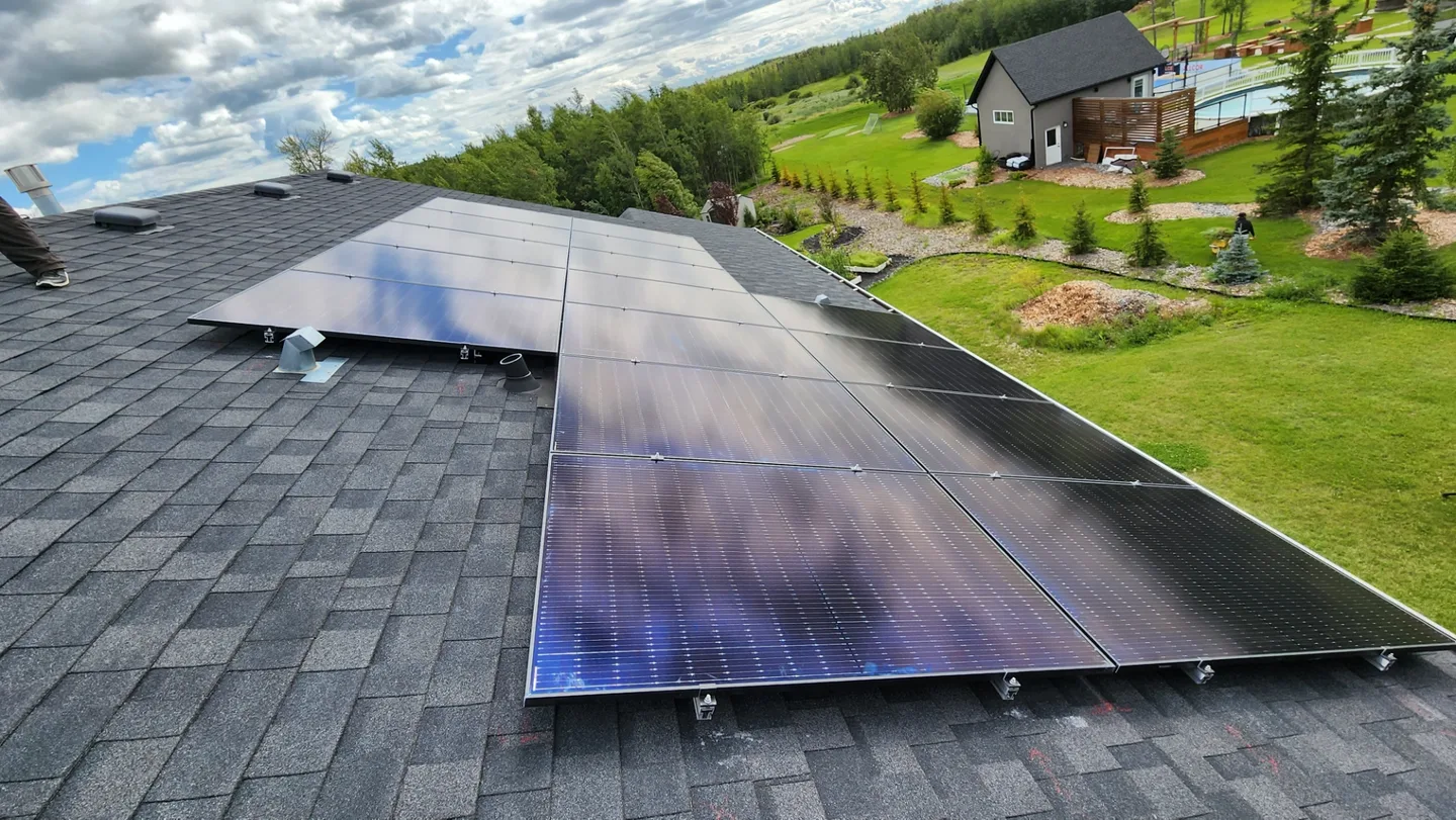 Flush black solar array on Dmitry Naboka's own Alberta home, panels floating with no visible cabling