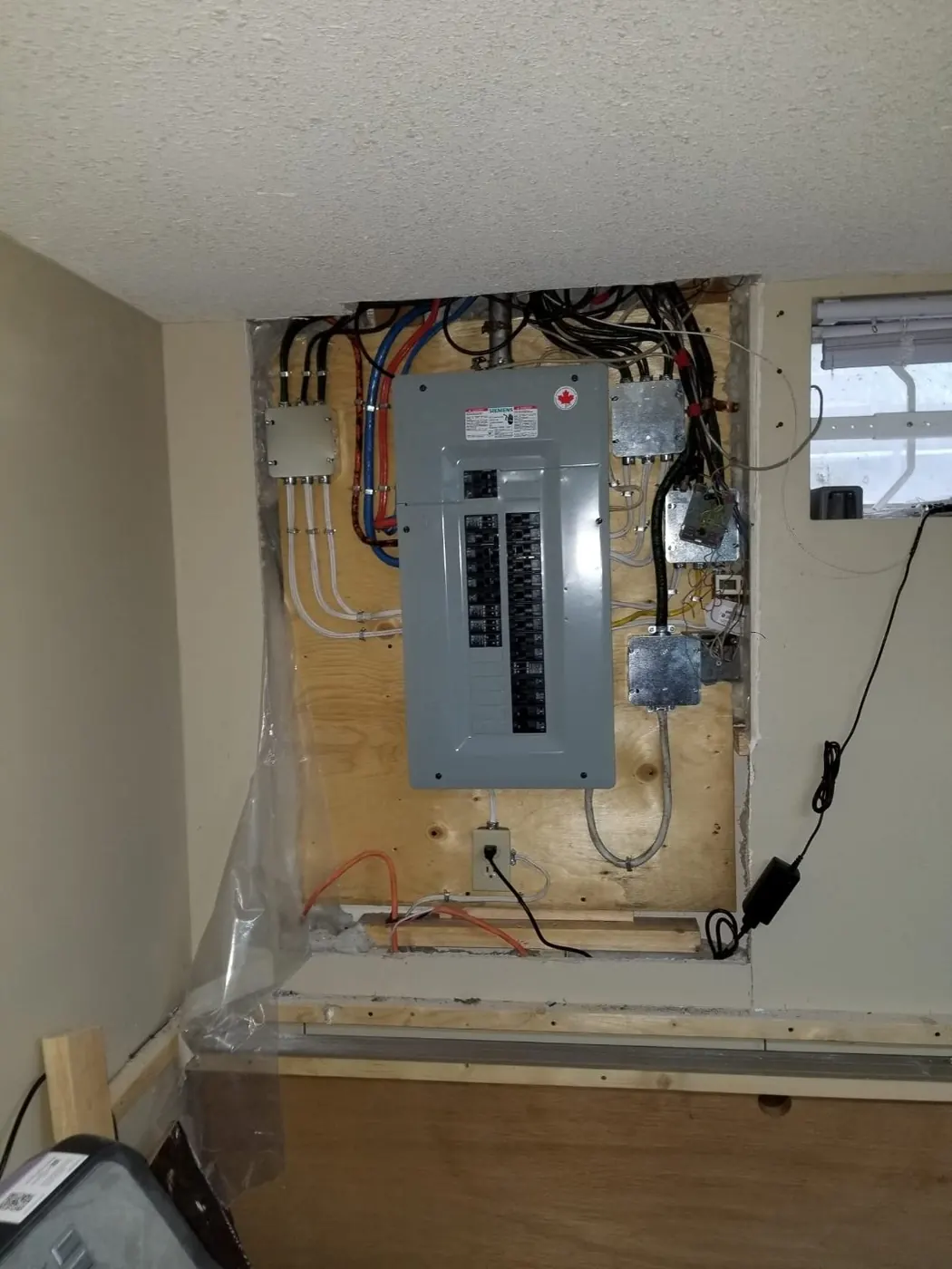 After: new Siemens electrical panel rough-in complete Edmonton