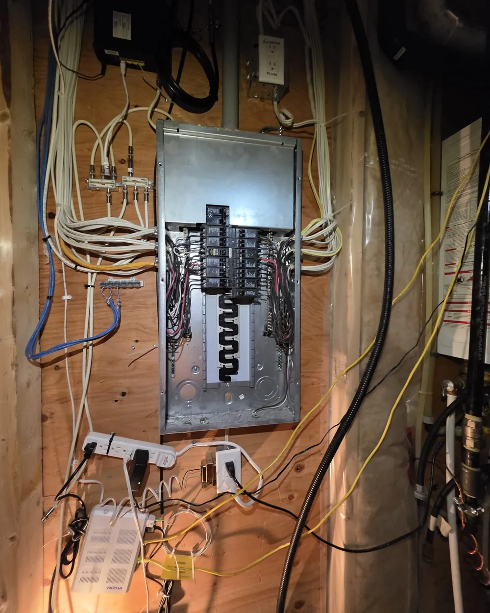 Electrical panel with the cover removed during an EV charger circuit installation in Edmonton.