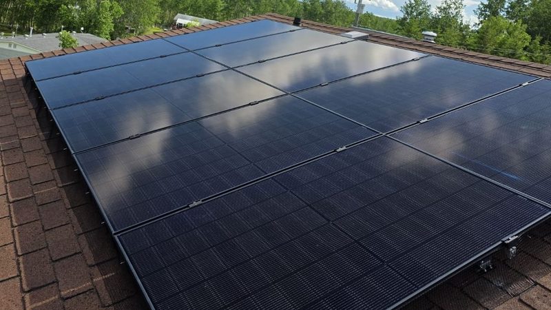 4.5 kW rooftop solar install by Raydn Renewables, Cherry Grove Alberta, black array on red shingles, 2026