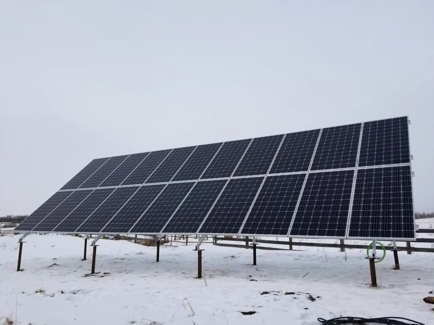 Ground mount solar array in winter snow Alberta