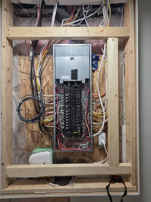The old grey electrical panel before the upgrade