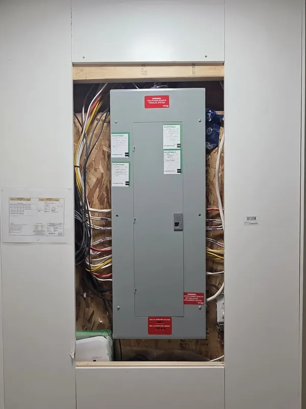 The old grey panel with its cover on, before the upgrade