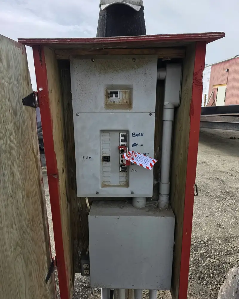 Outdoor yard service in a red wooden enclosure, locked out and tagged