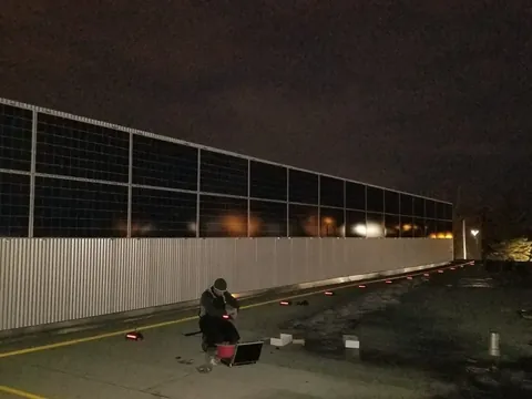 The same wall with the solar panels mounted, at commissioning