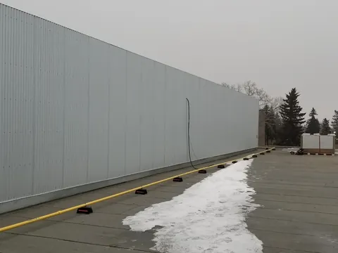 Commercial wall mount solar rails installed before panels, Edmonton