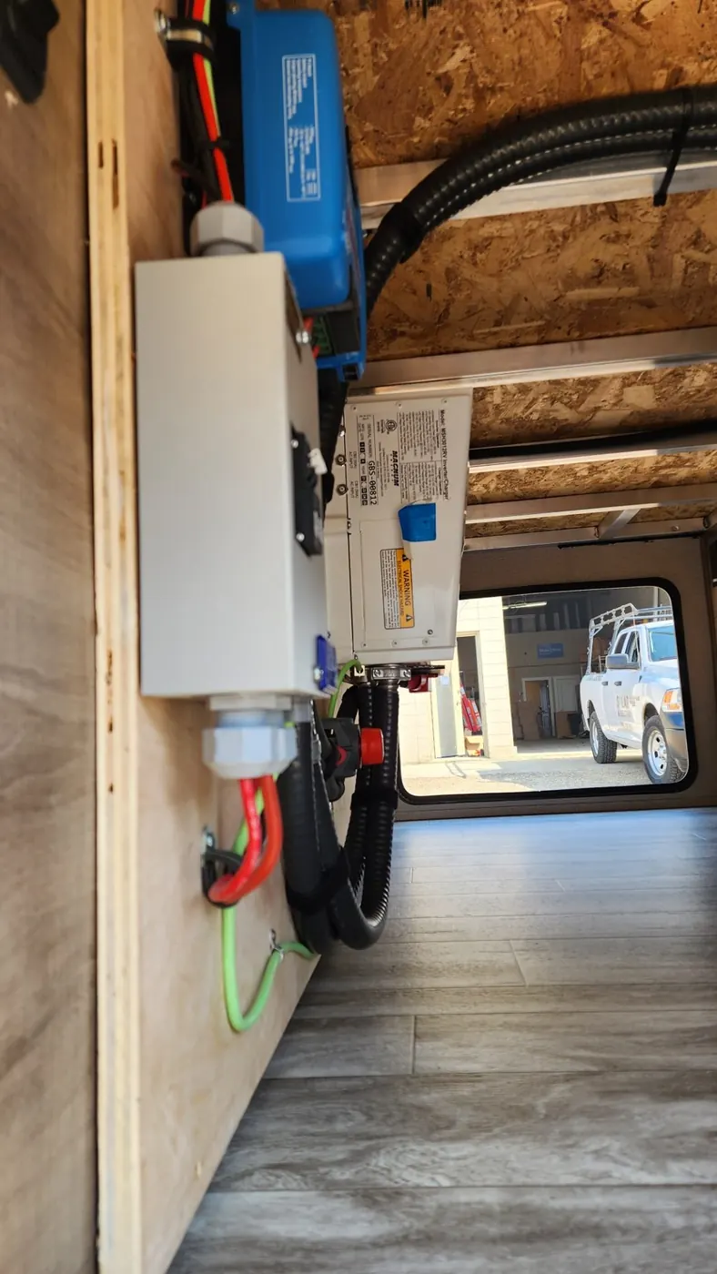 RV inverter and battery installation inside a trailer in Alberta
