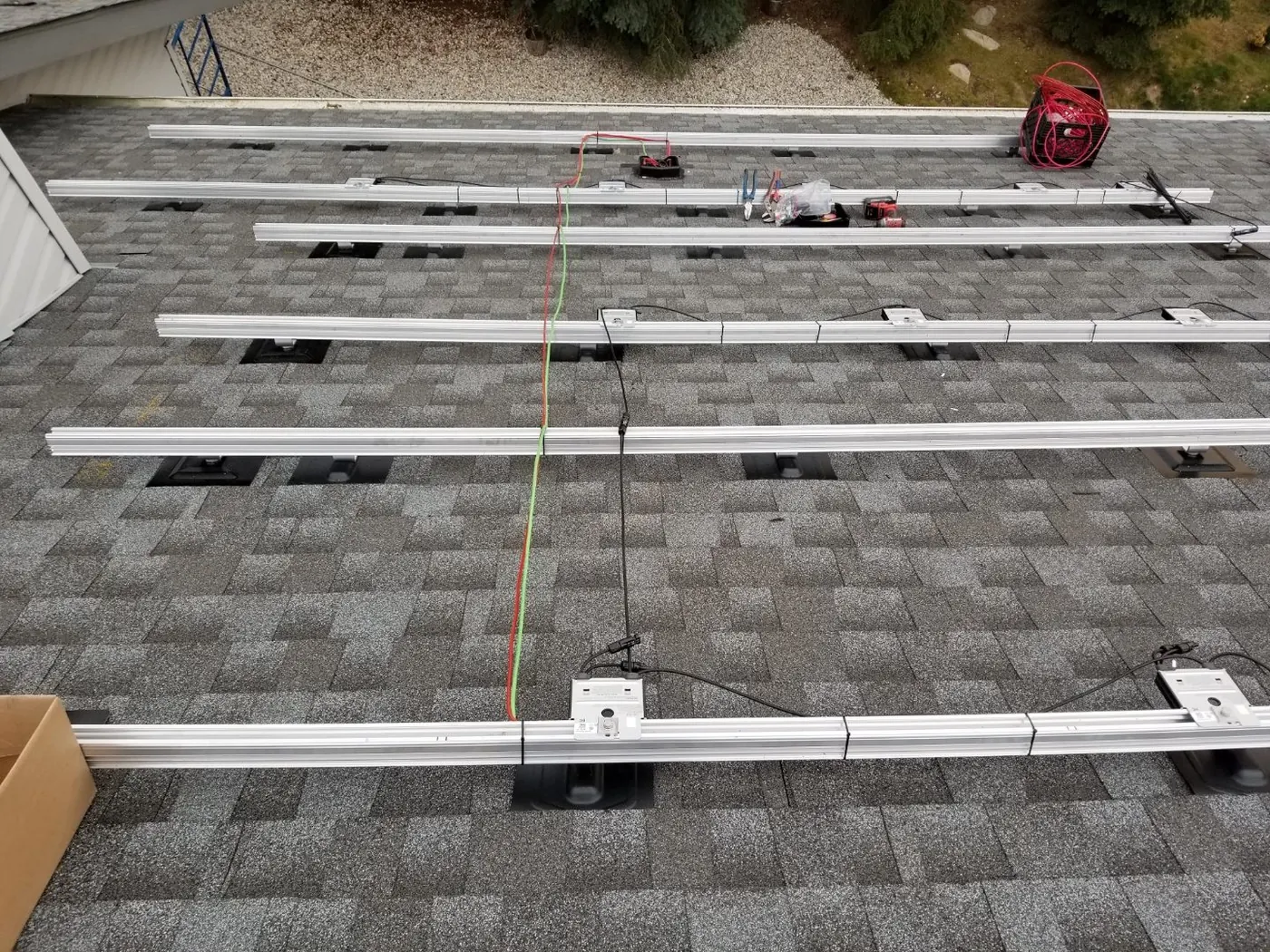 Same grey-roof home, rails only, before panels