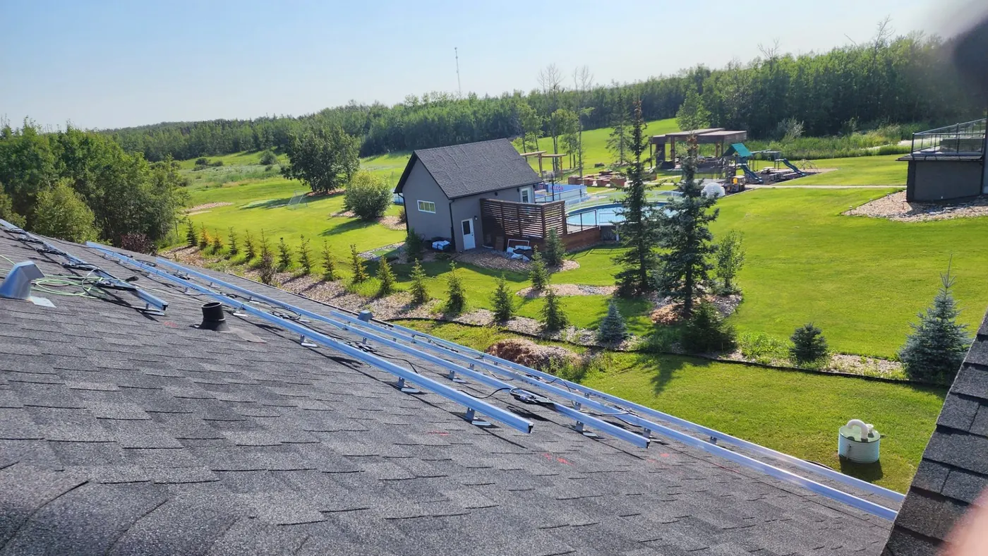 Before: solar mounting rails on rural acreage roof Alberta 2023