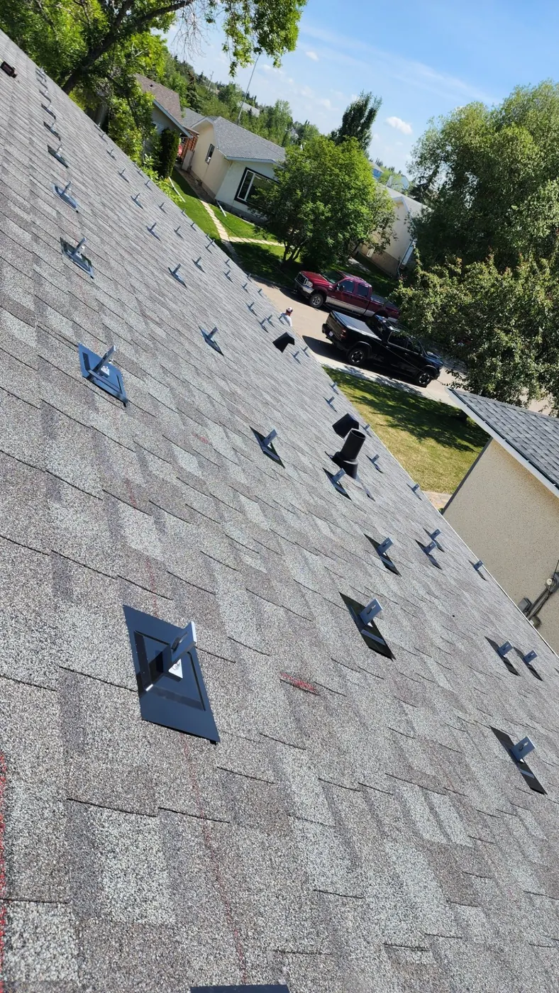 Roof with solar flashing hooks before panels Edmonton 2023