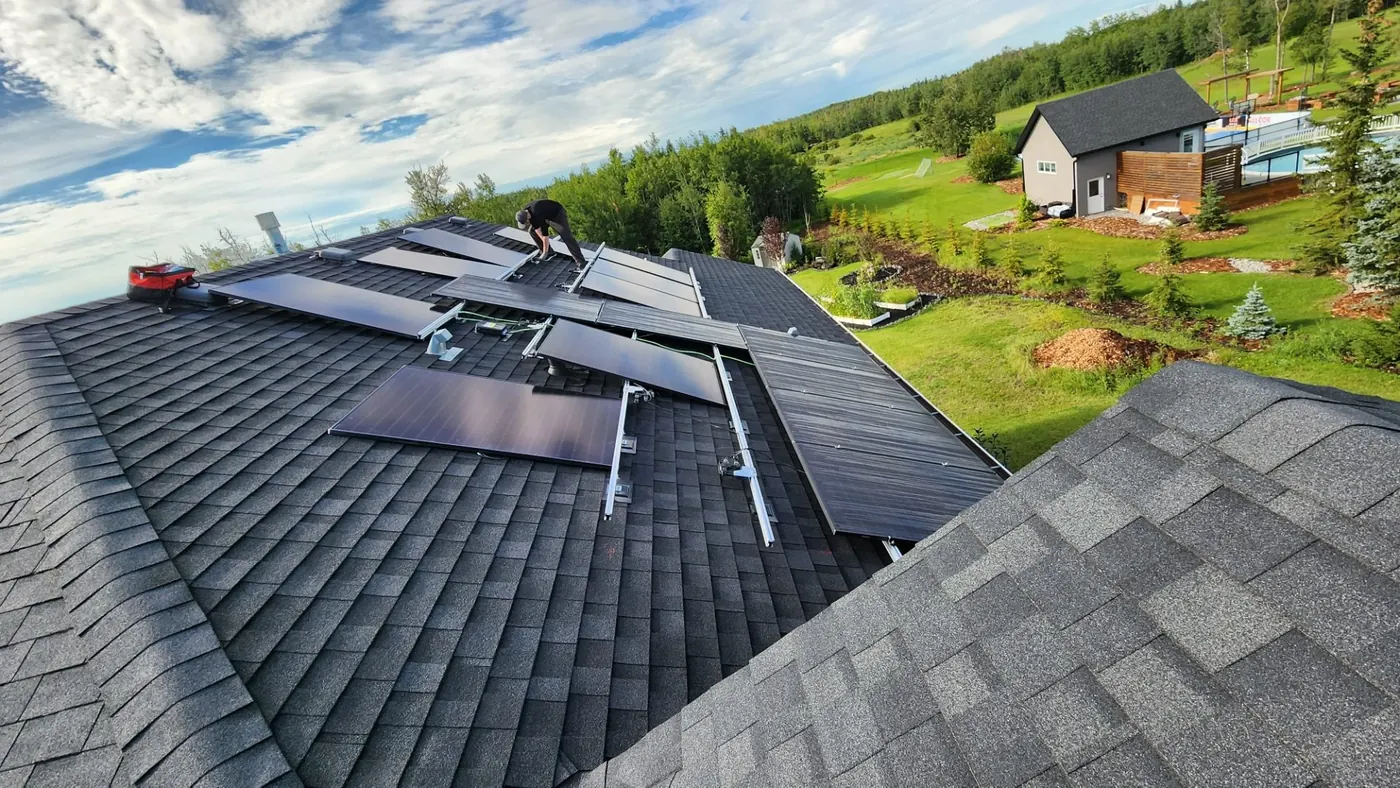 Solar panels being installed acreage rooftop rural Alberta 2023