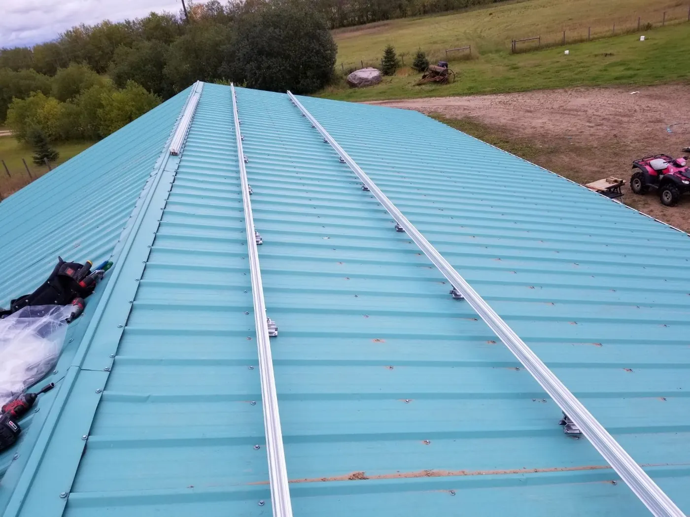 Solar mounting rails on metal barn roof rural Alberta