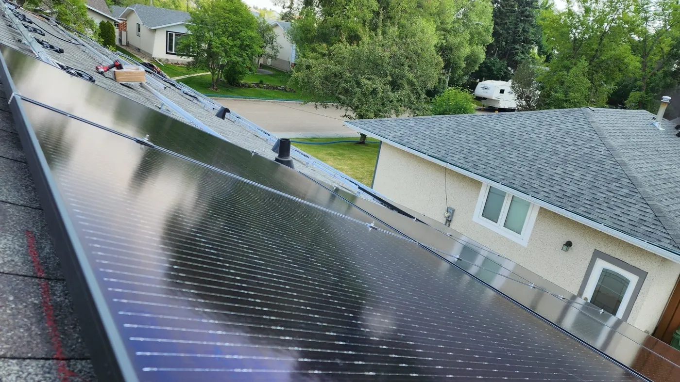 Solar panels being installed residential grey roof Edmonton 2023