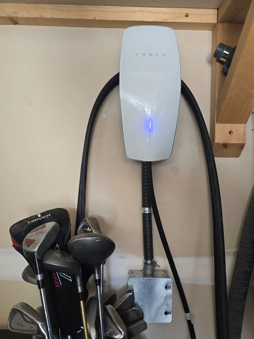 Tesla Wall Connector white installed in garage Edmonton