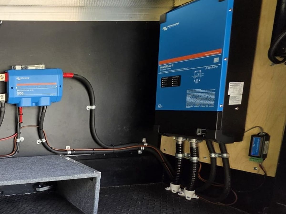 Victron MultiPlus-II inverter charger installed in an RV front compartment